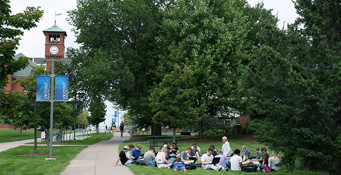 Photo - students enjoy a class held outdoors on campus
